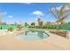 Inviting kidney shaped pool with grassy area at 557 S Visalia St, Mesa, AZ 85202