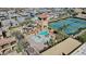 Aerial view of resort-style pool with waterslide and tennis courts at 6688 S Cartier Dr, Gilbert, AZ 85298