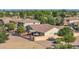 Aerial view of house and backyard with covered patio at 6688 S Cartier Dr, Gilbert, AZ 85298