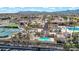 Aerial view of community pool, slide and tennis courts at 6688 S Cartier Dr, Gilbert, AZ 85298