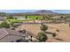 Aerial view showing house, backyard patio, and golf course at 6688 S Cartier Dr, Gilbert, AZ 85298