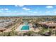 Aerial view of community pool and recreation area with palm trees at 6688 S Cartier Dr, Gilbert, AZ 85298