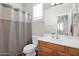 Bathroom with single vanity and shower/tub combo at 6688 S Cartier Dr, Gilbert, AZ 85298