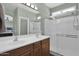 Double vanity bathroom with a large walk-in shower at 6688 S Cartier Dr, Gilbert, AZ 85298