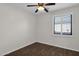 Small bedroom with wood floors and window shutters at 6688 S Cartier Dr, Gilbert, AZ 85298