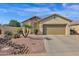 Single-story home with desert landscaping at 6688 S Cartier Dr, Gilbert, AZ 85298