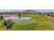 Golf course with pond and mountain views at 6688 S Cartier Dr, Gilbert, AZ 85298