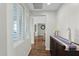 Bright hallway with wood floors and decorative accents at 6688 S Cartier Dr, Gilbert, AZ 85298