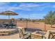 Patio seating area with fire pit and mountain views at 6688 S Cartier Dr, Gilbert, AZ 85298