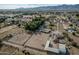 Aerial view of property with a house, arena, and large lot; mountain backdrop at 6841 N 183Rd Ave, Waddell, AZ 85355