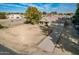 Aerial view of a house with a large yard and driveway at 6841 N 183Rd Ave, Waddell, AZ 85355