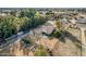 Aerial view of a house and large lot with playground; mountain views at 6841 N 183Rd Ave, Waddell, AZ 85355