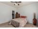 Bedroom with ceiling fan and patterned bedding at 6841 N 183Rd Ave, Waddell, AZ 85355