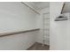 Large walk-in closet with shelves and hanging rods at 6841 N 183Rd Ave, Waddell, AZ 85355