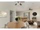 Bright dining area with a wooden table and neutral decor at 6841 N 183Rd Ave, Waddell, AZ 85355