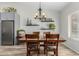 Dining room features a wooden table with chairs and a chandelier at 6841 N 183Rd Ave, Waddell, AZ 85355