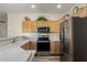 Kitchen with stainless steel appliances and wood cabinets at 6841 N 183Rd Ave, Waddell, AZ 85355