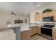 Kitchen with stainless steel appliances and breakfast bar at 6841 N 183Rd Ave, Waddell, AZ 85355