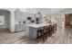 Modern kitchen with gray cabinets and large island at 6841 N 183Rd Ave, Waddell, AZ 85355