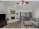 Living room features a white brick fireplace and access to backyard at 6841 N 183Rd Ave, Waddell, AZ 85355