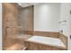 Bathroom with shower, soaking tub, and tile at 7039 E Main St # A206, Scottsdale, AZ 85251