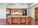 Modern kitchen with island and wood cabinets at 7039 E Main St # A206, Scottsdale, AZ 85251