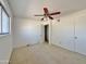 Spacious bedroom with ceiling fan and carpet at 731 E Manor Dr, Casa Grande, AZ 85122