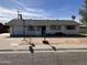 Ranch style home with carport and front yard at 731 E Manor Dr, Casa Grande, AZ 85122