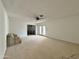 Living room with carpet flooring and access to backyard at 731 E Manor Dr, Casa Grande, AZ 85122