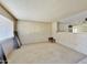 Living room with wood paneling and carpeted floors at 731 E Manor Dr, Casa Grande, AZ 85122