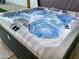 Modern hot tub with bubbling jets and ambient lighting at 7715 E Catalina Dr, Scottsdale, AZ 85251