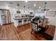 Open concept kitchen and dining area with an island and farmhouse style table at 7715 E Catalina Dr, Scottsdale, AZ 85251