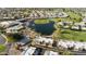 Aerial view of community pool, lake, and homes at 7732 E Desert Flower Ave, Mesa, AZ 85208