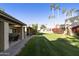 Brick pathway leads to a relaxing patio area at 7732 E Desert Flower Ave, Mesa, AZ 85208