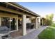 Covered patio with seating area and grill at 7732 E Desert Flower Ave, Mesa, AZ 85208