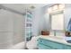 Clean bathroom with teal vanity and shower/tub combo at 7800 E Lincoln Dr # 2053, Scottsdale, AZ 85250