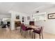 Bright dining room with a wooden table and purple chairs at 7800 E Lincoln Dr # 2053, Scottsdale, AZ 85250