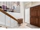 Bright entryway with wooden staircase and tiled floor at 7800 E Lincoln Dr # 2053, Scottsdale, AZ 85250