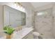 Modern bathroom with marble shower, gold fixtures, and a vanity at 7818 W Encinas Ln, Phoenix, AZ 85043