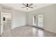 Bedroom with tile floors, ceiling fan and kitchen view at 7818 W Encinas Ln, Phoenix, AZ 85043