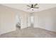 Bright bedroom with ceiling fan and en-suite bathroom at 7818 W Encinas Ln, Phoenix, AZ 85043