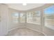 Bright breakfast nook with three windows and wood-look tile at 7818 W Encinas Ln, Phoenix, AZ 85043