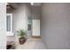 Inviting entryway with decorative door and potted plant at 7818 W Encinas Ln, Phoenix, AZ 85043