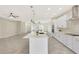 Modern kitchen with white shaker cabinets and a large kitchen island at 7818 W Encinas Ln, Phoenix, AZ 85043