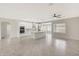 Modern kitchen with white cabinets and a large island at 7818 W Encinas Ln, Phoenix, AZ 85043