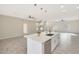 Modern kitchen island with white cabinetry and quartz countertops at 7818 W Encinas Ln, Phoenix, AZ 85043