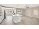 Modern white kitchen with a large island and breakfast nook at 7818 W Encinas Ln, Phoenix, AZ 85043