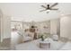 Bright living room with open floor plan, featuring comfortable seating and large windows at 7818 W Encinas Ln, Phoenix, AZ 85043