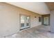 Covered patio with double French doors and exterior lighting at 7818 W Encinas Ln, Phoenix, AZ 85043