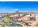 Community overview with pond and mountains at 7910 E Camelback Rd # 312, Scottsdale, AZ 85251